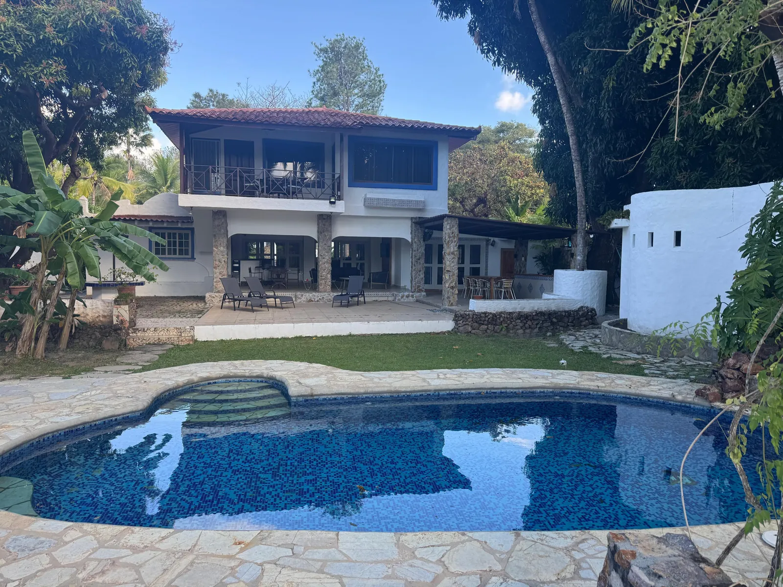 The house at dusk — Spanish Colonial home for sale at Coronado Golf Club, Panama