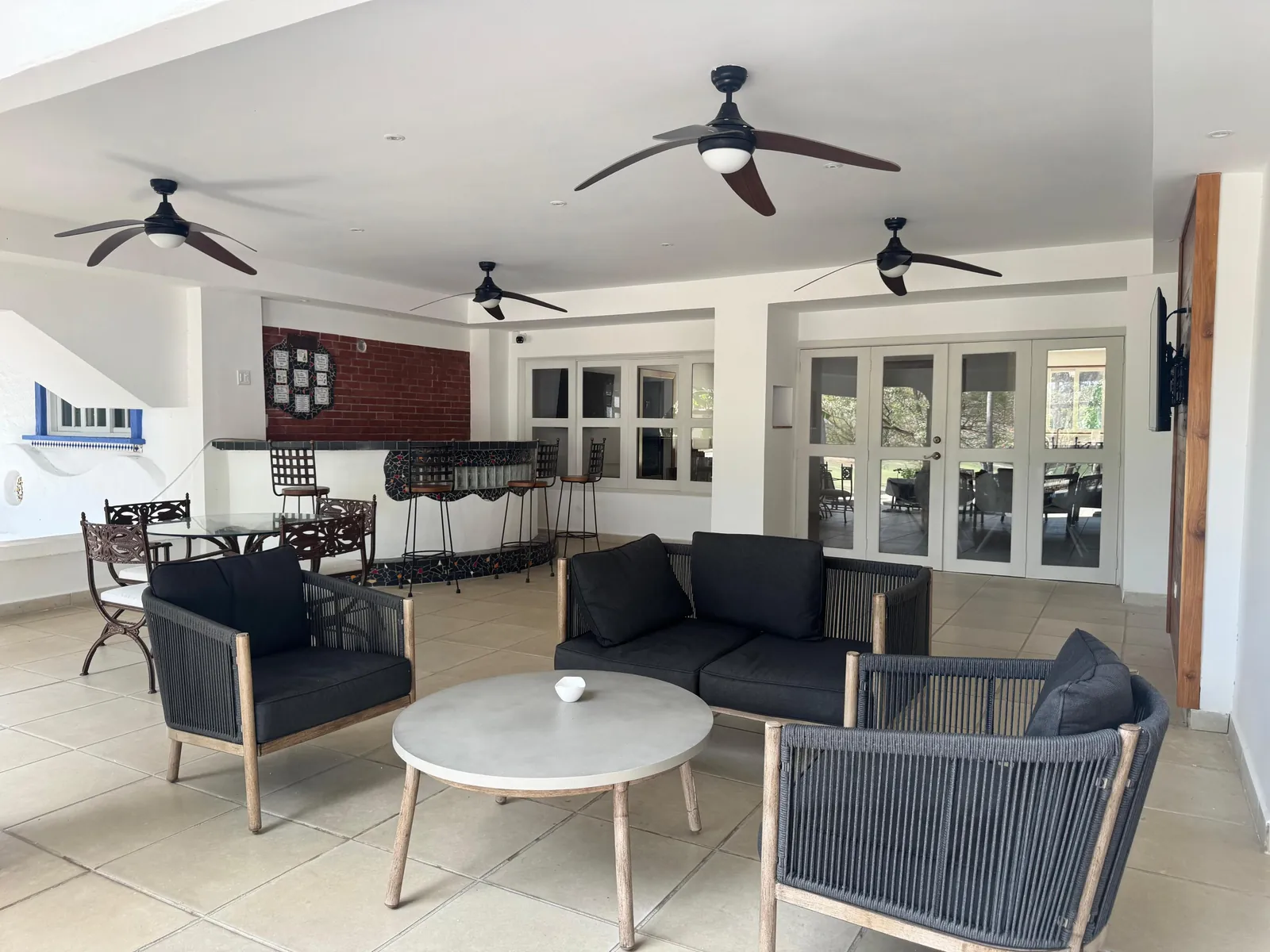 Covered terrace seating — Spanish Colonial home for sale at Coronado Golf Club, Panama