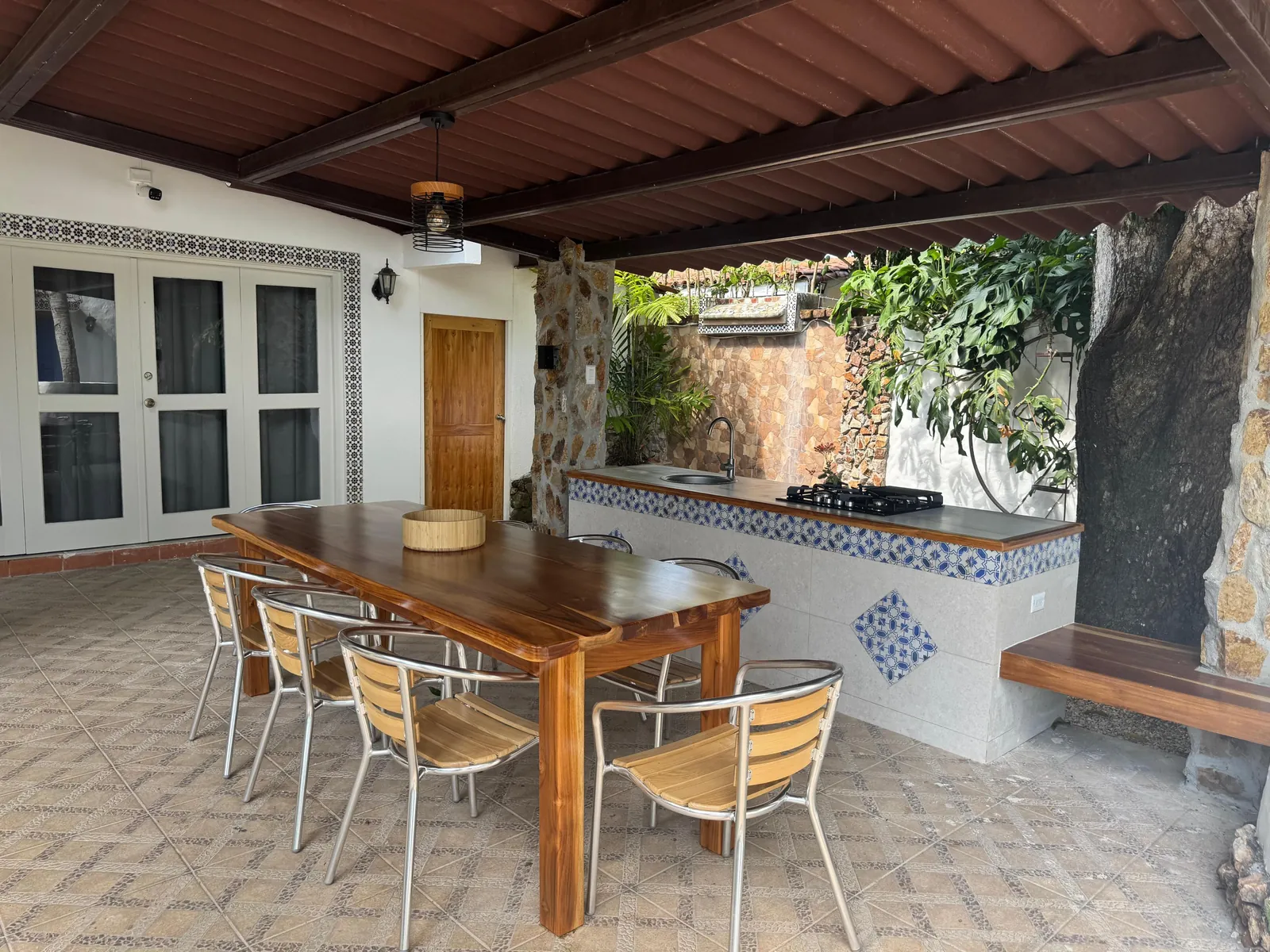 Summer kitchen and terrace dining — Spanish Colonial home for sale at Coronado Golf Club, Panama