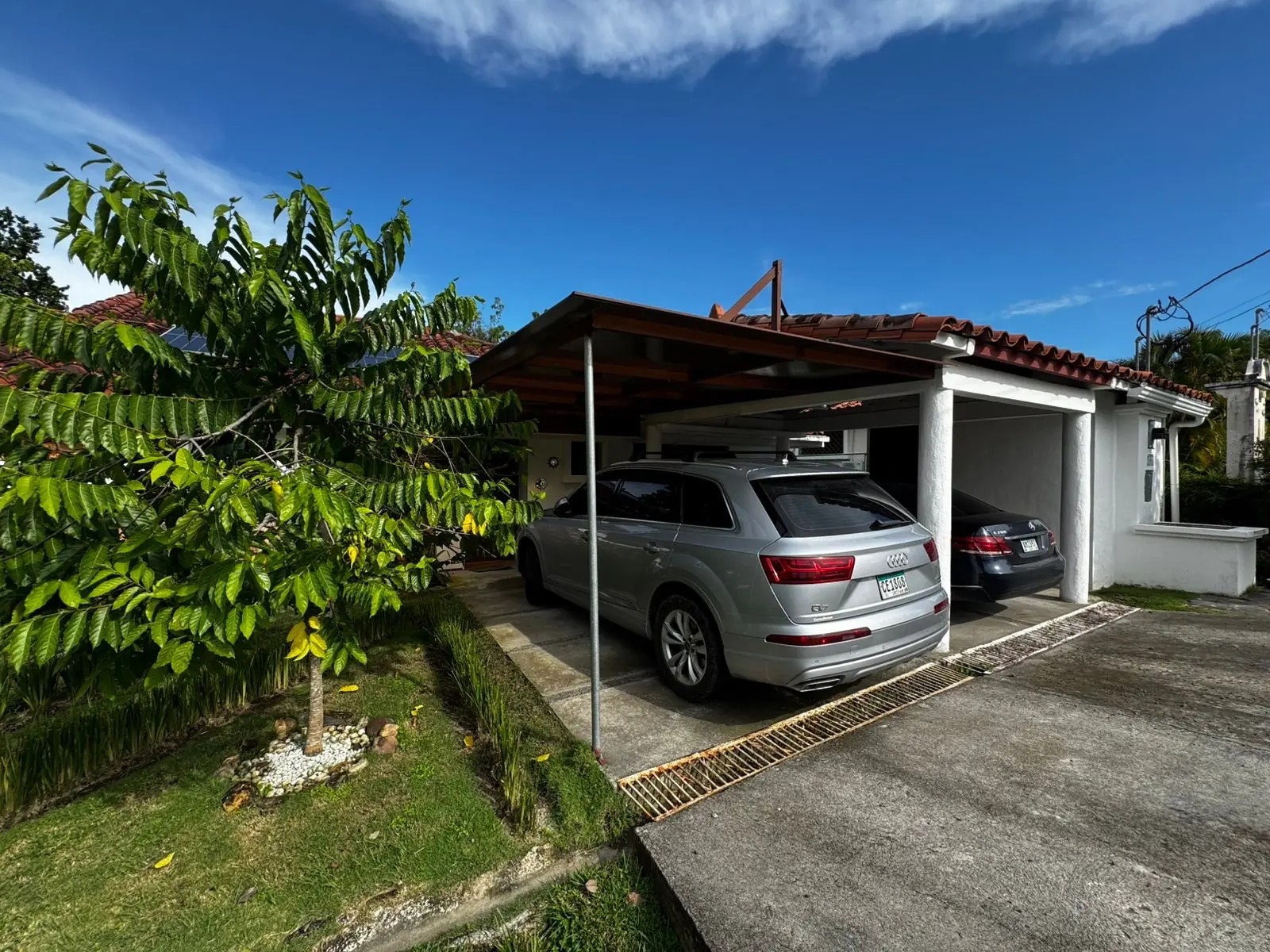 Covered parking and fruit trees — lakeside home for sale at Club Ecuestre de Coronado, Panama