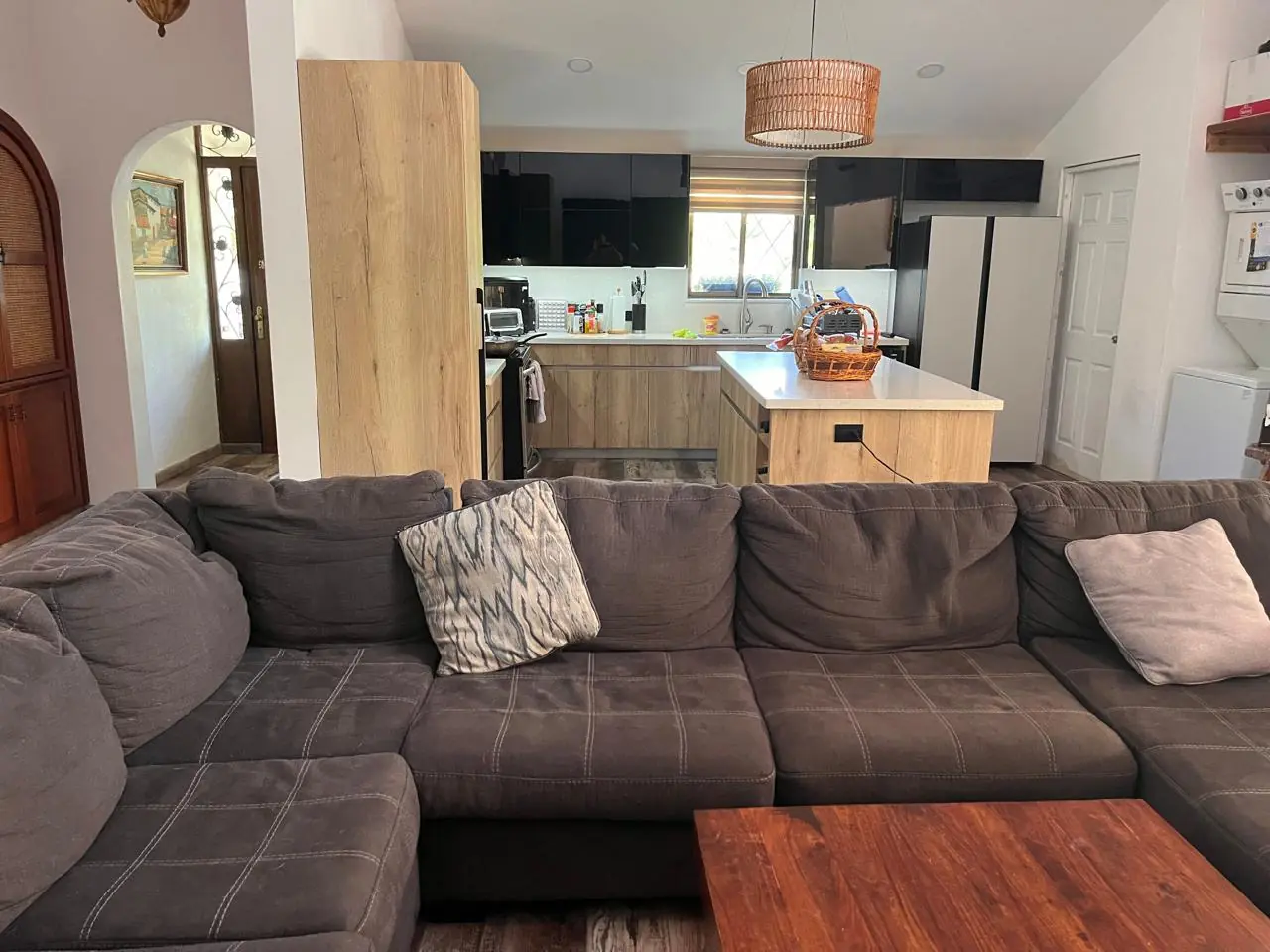 Sitting area with the kitchen beyond — lakeside home for sale at Club Ecuestre de Coronado, Panama