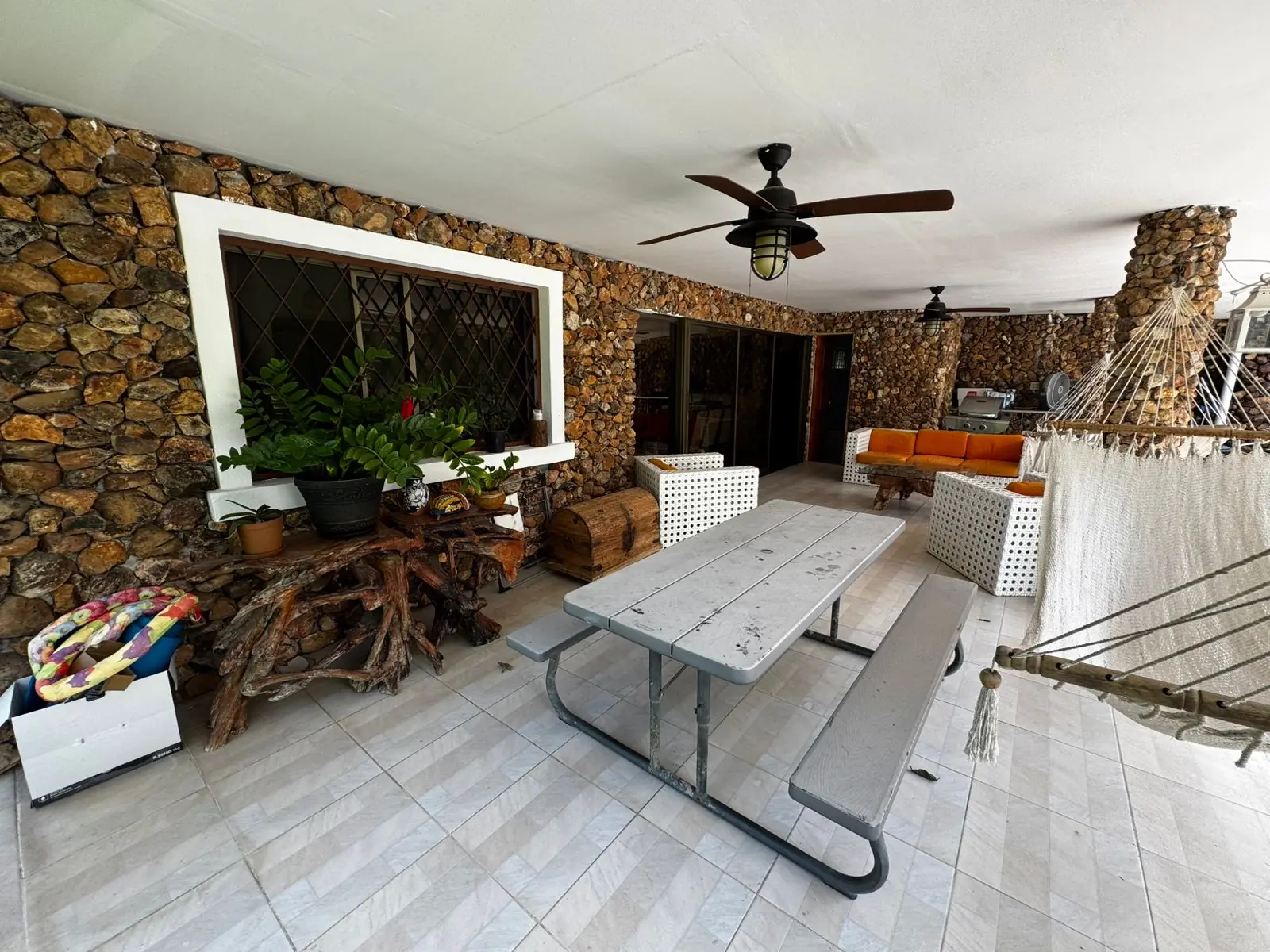 Terrace and BBQ area — lakeside home for sale at Club Ecuestre de Coronado, Panama