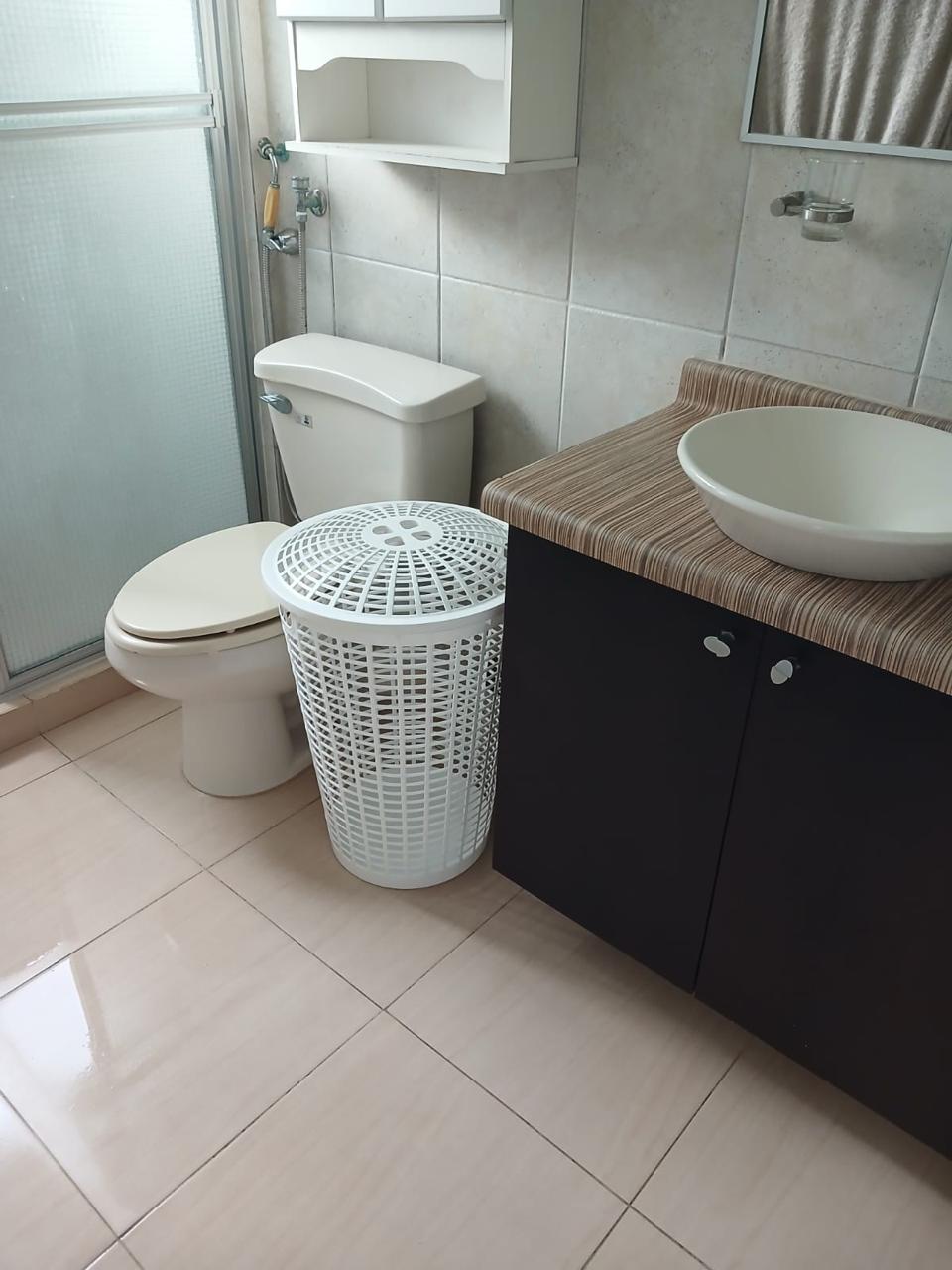 Primary bathroom with modern vanity and walk-in shower