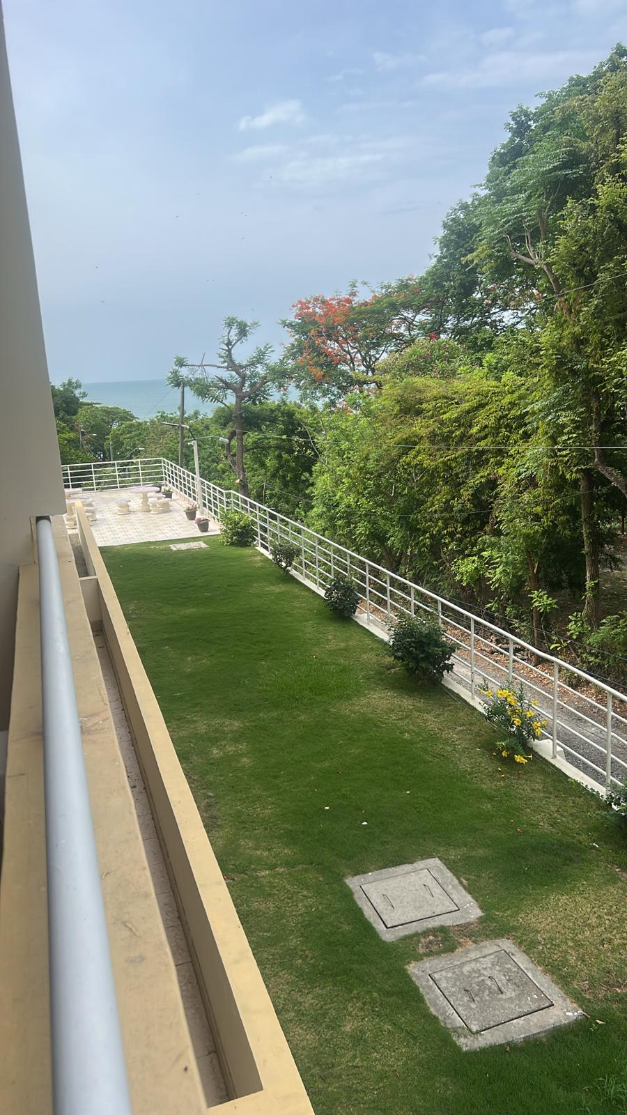 Pacific Ocean visible from the balcony with terrace and garden