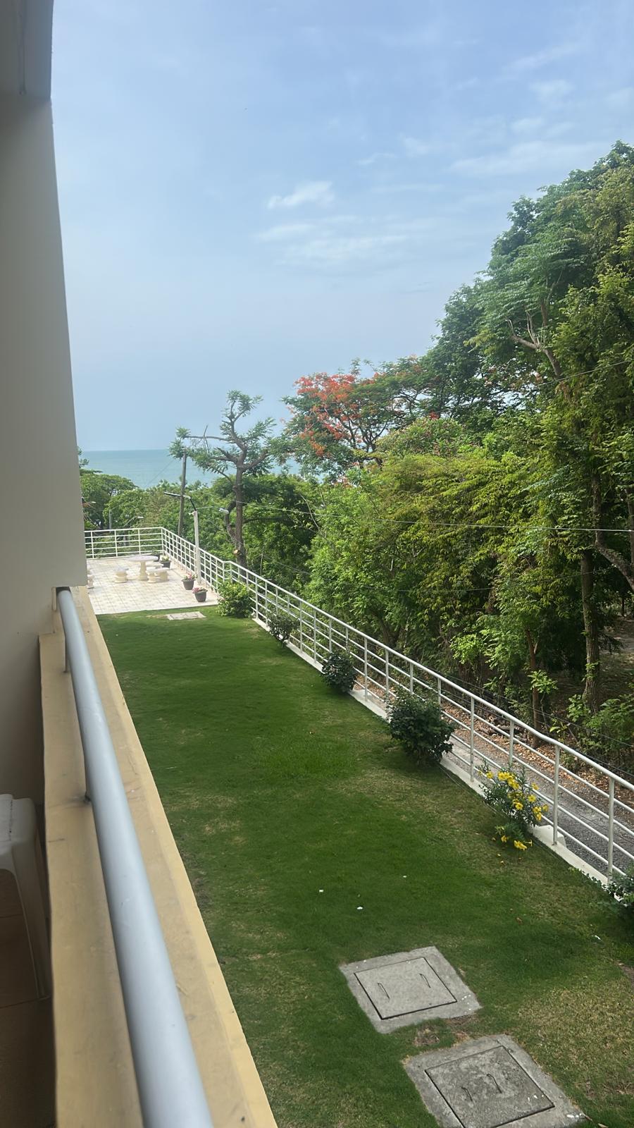 Pacific Ocean view from balcony with garden below