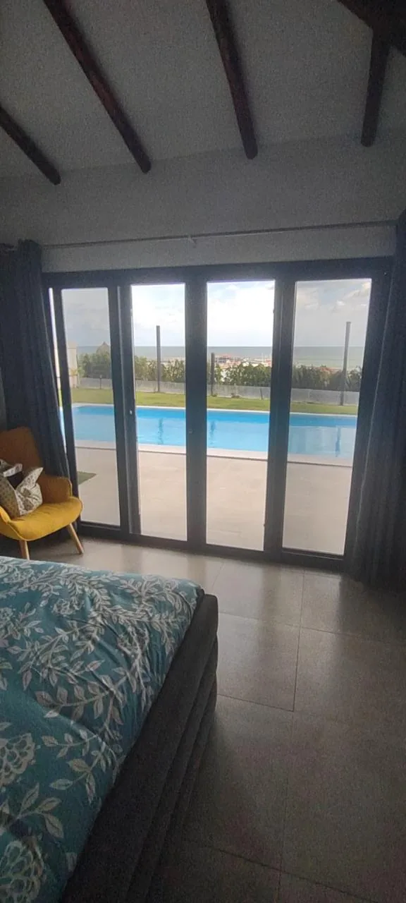 Pool and sea from the bedroom — ocean-view home for sale in Terrazas de Vista Mar, San Carlos, Panama