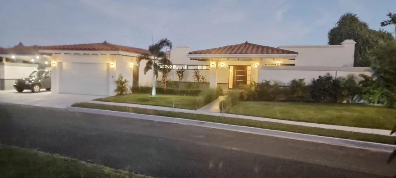 The front of the house at dusk — ocean-view home for sale in Terrazas de Vista Mar, San Carlos, Panama