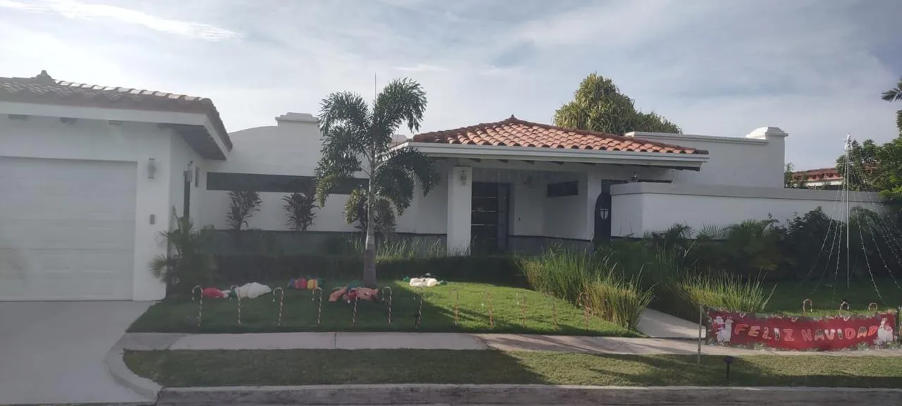 Street view, garage and garden — ocean-view home for sale in Terrazas de Vista Mar, San Carlos, Panama