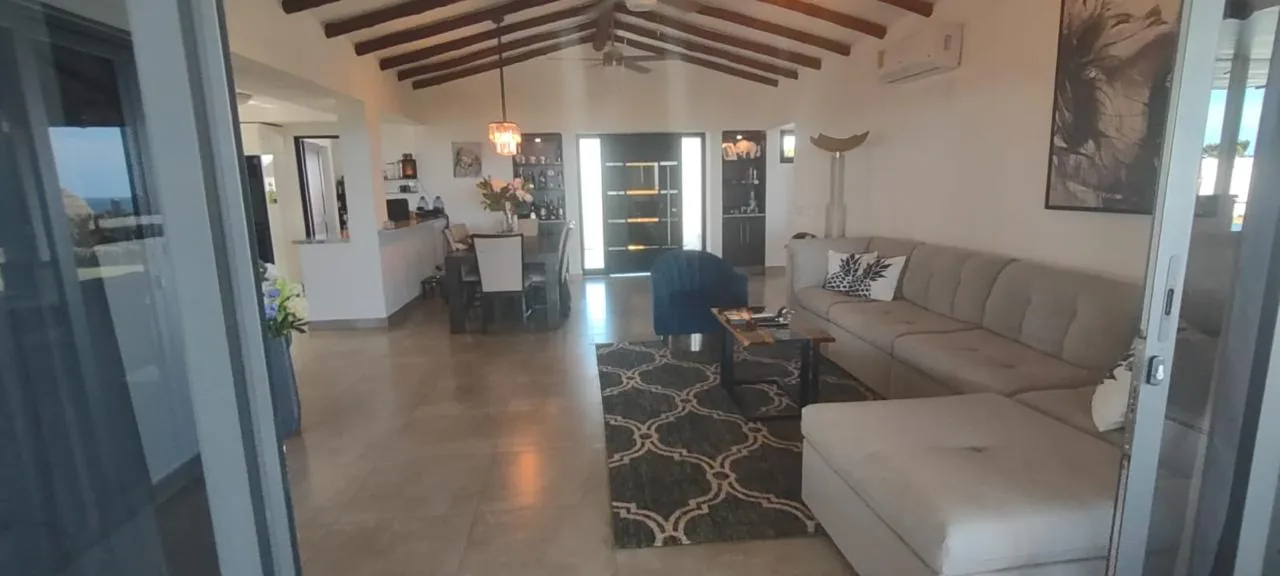 Living room under the beamed ceiling — ocean-view home for sale in Terrazas de Vista Mar, San Carlos, Panama